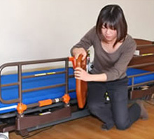 Broken arm caused by standing up without confirming that the bed grip was locked in place.